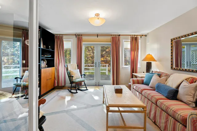 a view of backyard with deck and wooden floor