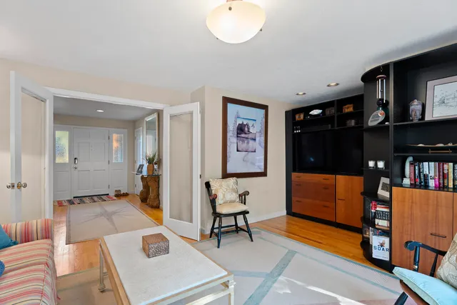 a bathroom with a granite countertop sink a toilet and shower