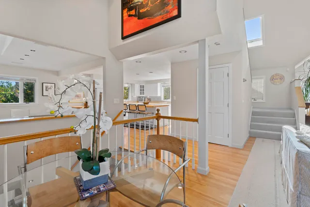 a view of a livingroom with furniture and hardwood floor