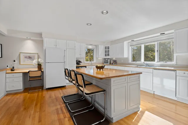 a kitchen with counter top space a sink cabinets and appliances