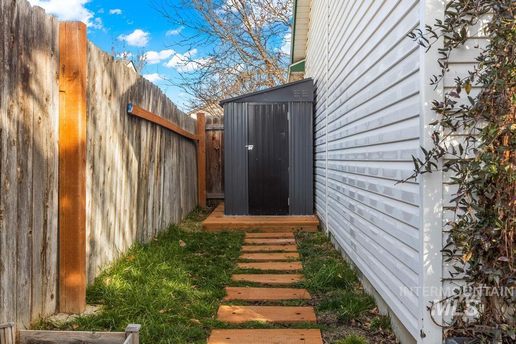 1206 Flint Drive Caldwell, ID 83607 - Photo 16 of 20 Fenced backyard with a storage shed