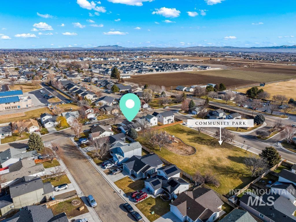 1206 Flint Drive Caldwell, ID 83607 - Photo 19 of 20 Aerial overview of property's location with nearby suburban area and mountains