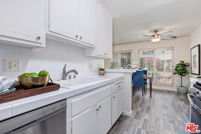 a spacious bedroom with a bed and a couch