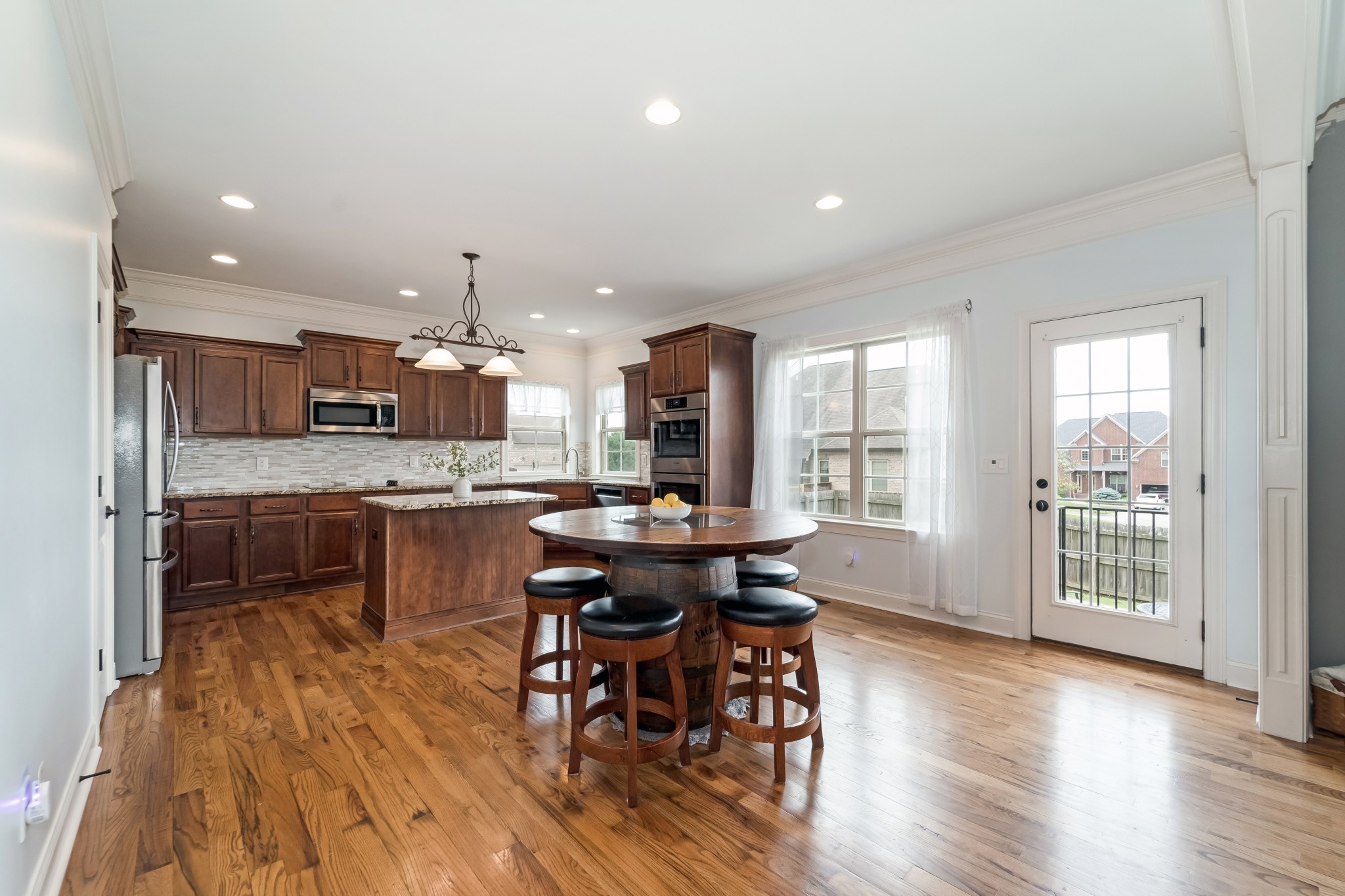 3008 Sakari Circle Spring Hill, TN 37174 - Photo 16 of 44 a kitchen with a table and chairs in it