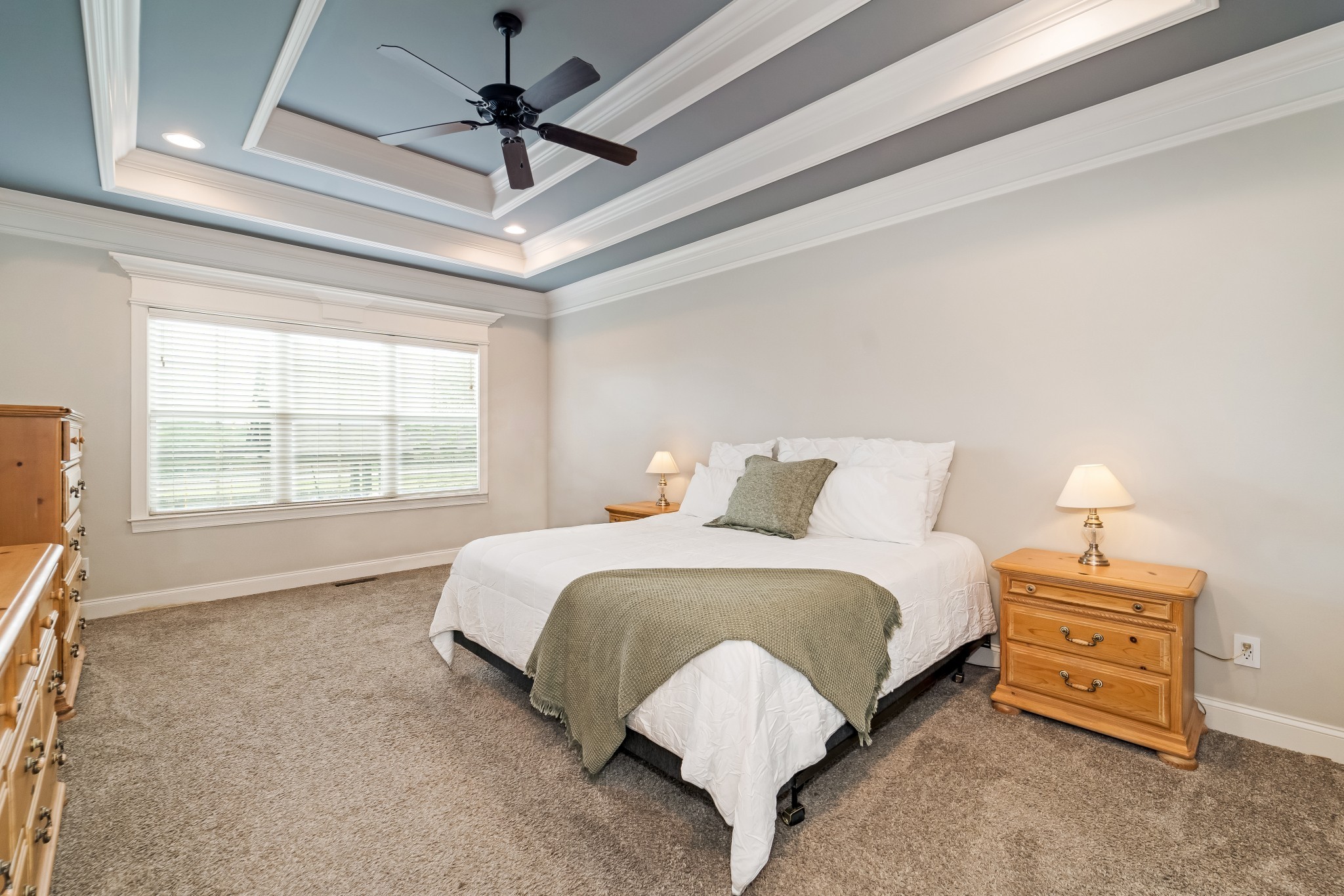 3008 Sakari Circle Spring Hill, TN 37174 - Photo 19 of 44 a spacious bedroom with a bed a chandelier and a window