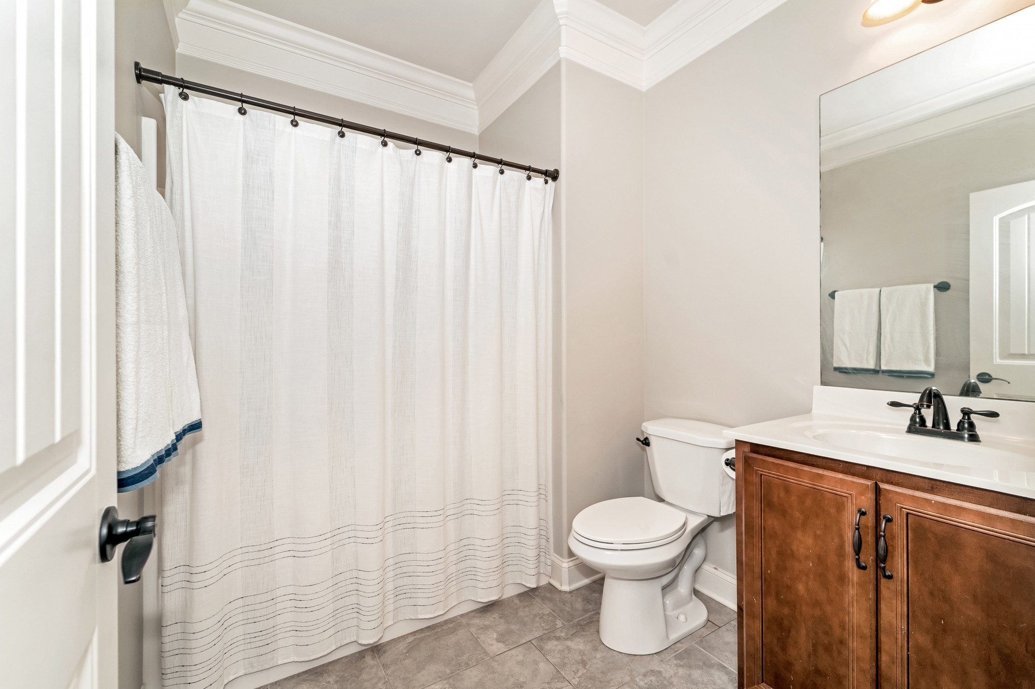 3008 Sakari Circle Spring Hill, TN 37174 - Photo 33 of 44 a bathroom with a toilet a sink and a shower