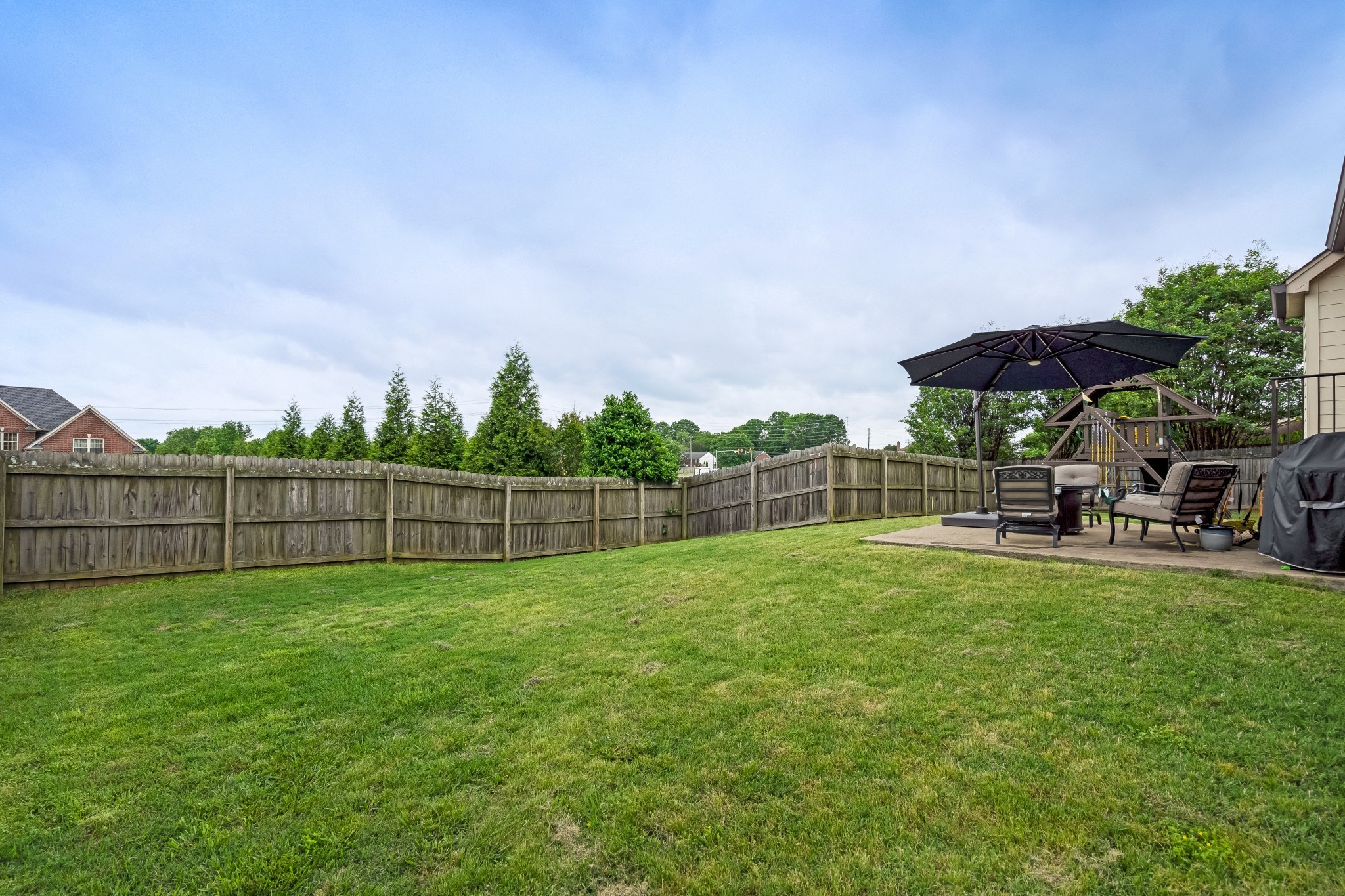 3008 Sakari Circle Spring Hill, TN 37174 - Photo 40 of 44 a view of a backyard with a garden and stairs