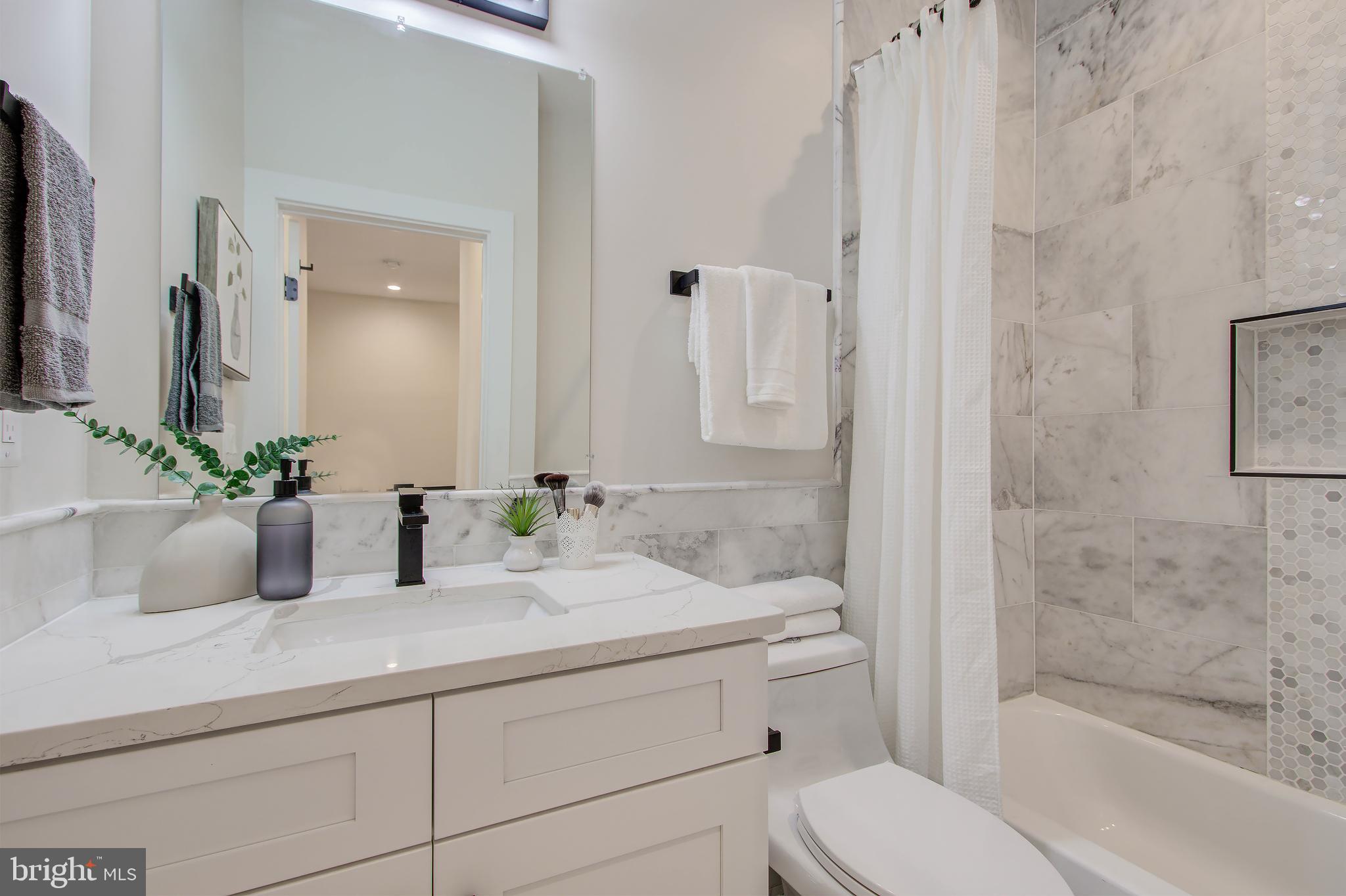 909 L Street Northeast Washington, DC 20002 - Photo 20 of 30 Bathroom 2 with Marble Tiles