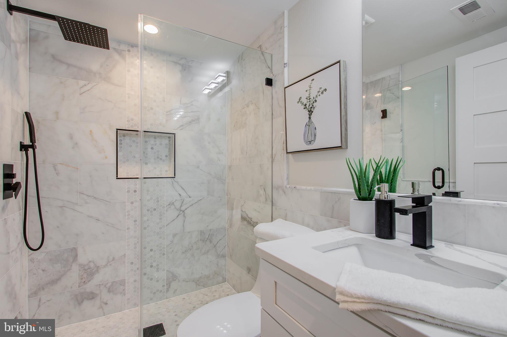 909 L Street Northeast Washington, DC 20002 - Photo 24 of 30 Lower Level Full Bath with Marble Tiles