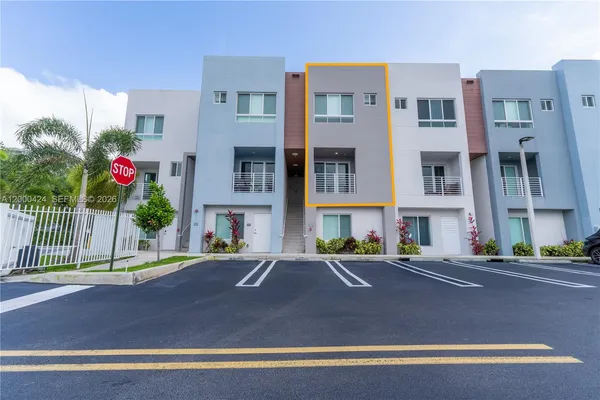 a front view of a building with street view