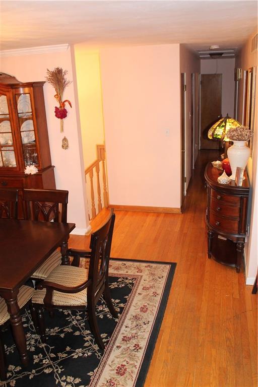 125 Meadowbrook Road Renfrew, PA 16053 - Photo 7 of 18 Main floor hallway beautiful hardwood floors