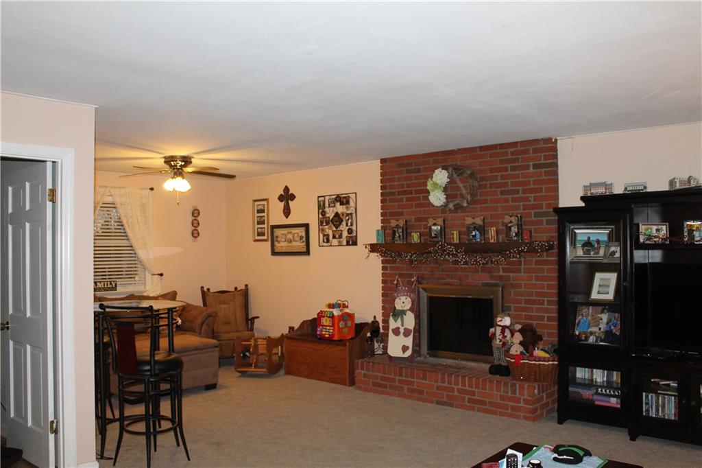 125 Meadowbrook Road Renfrew, PA 16053 - Photo 9 of 18 The other side of the large upper family room with wood burning fireplace and note room left can be home office