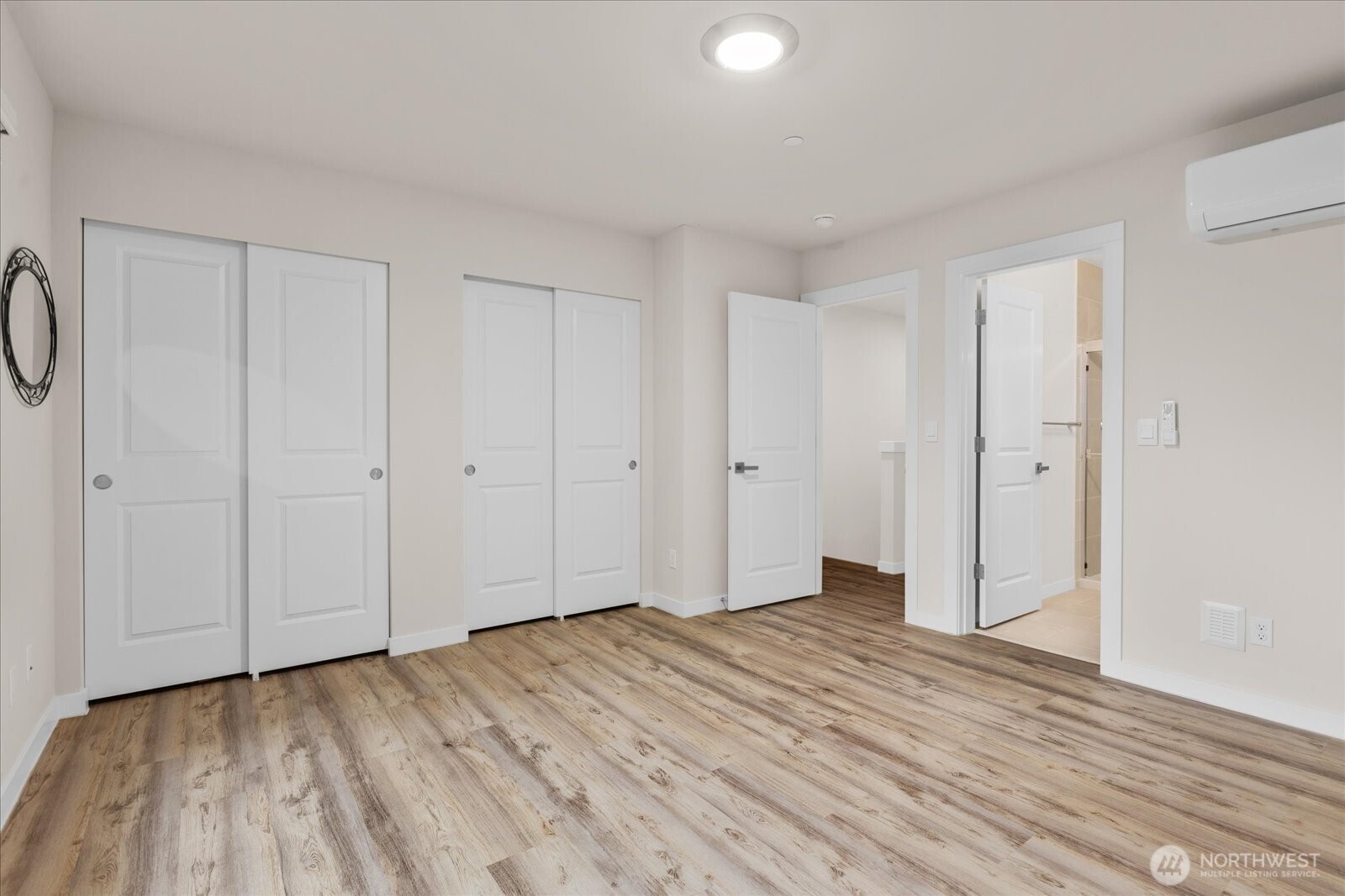 23413 Edmonds Way, Unit A2 Edmonds, WA 98026 - Photo 21 of 40 a view of an empty room with wooden floor