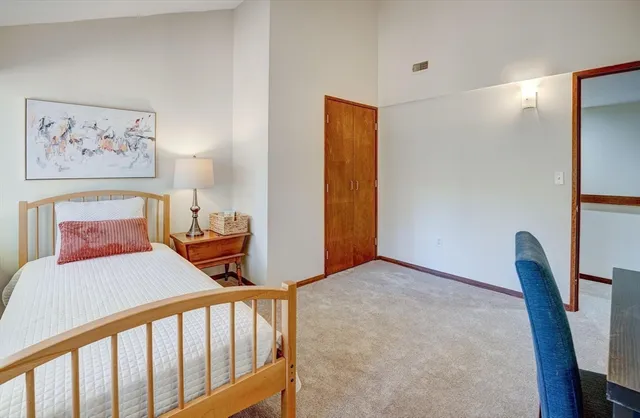 a bedroom with furniture and wooden floor