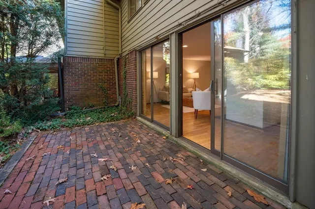 a view of a glass door with a yard