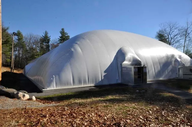 a lobby with furniture and floor to ceiling window
