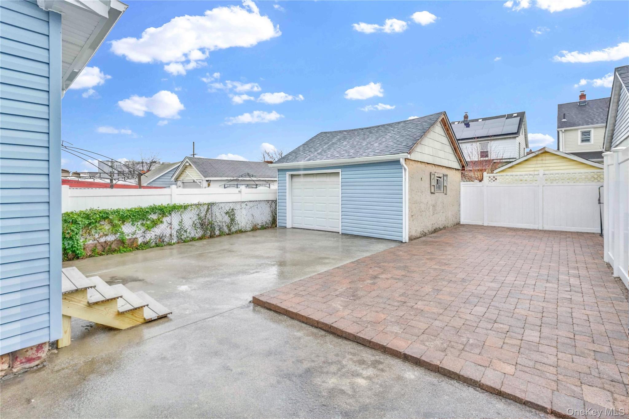 21432 112th Road Queens, NY 11429 - Photo 16 of 18 Garage featuring driveway