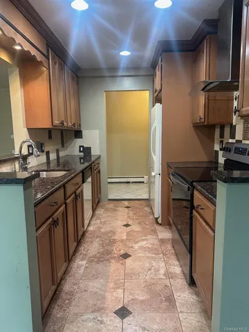 a kitchen with sink cabinets and stove