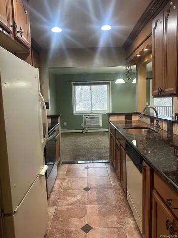 a large bathroom with a granite countertop sink a large mirror and a shower