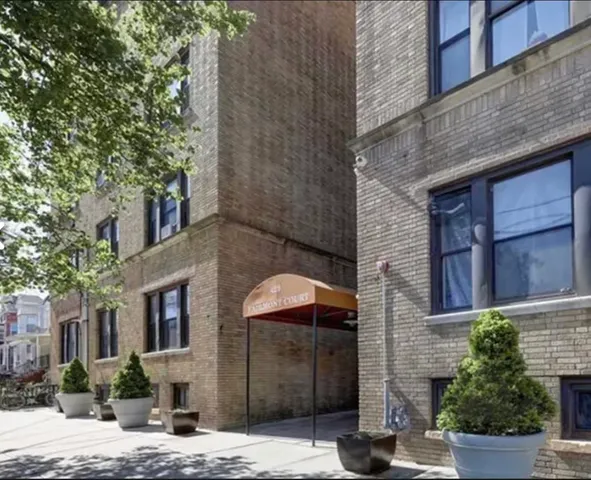 a front view of a building with street view