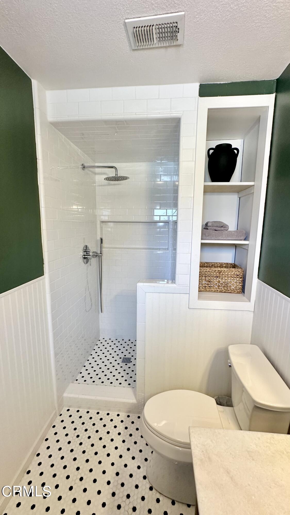 4621 Hamilton Avenue Oxnard, CA 93033 - Photo 13 of 22 a bathroom with a toilet and a shower