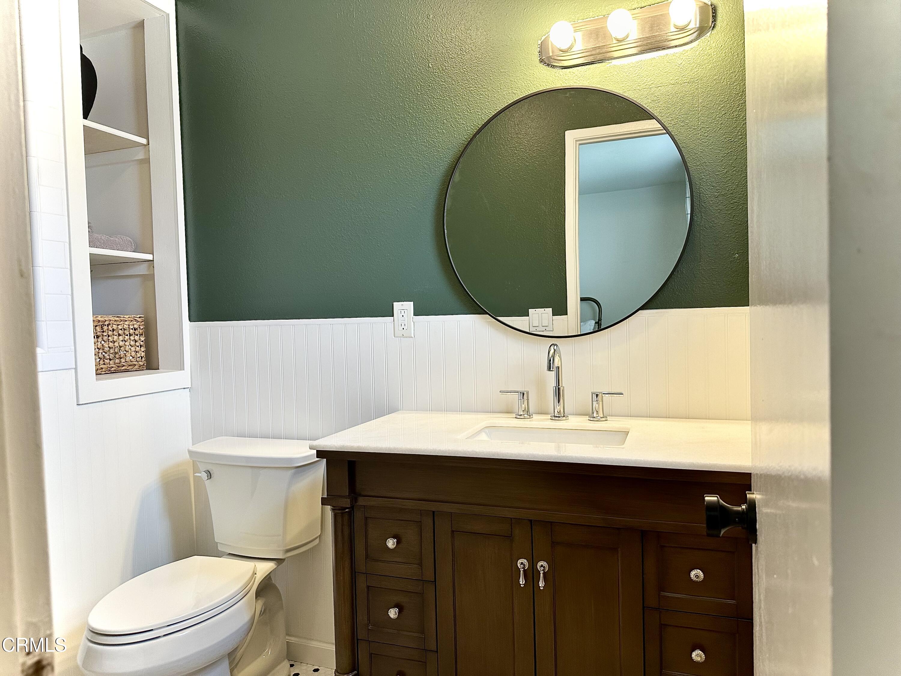4621 Hamilton Avenue Oxnard, CA 93033 - Photo 14 of 22 a bathroom with a sink and a mirror