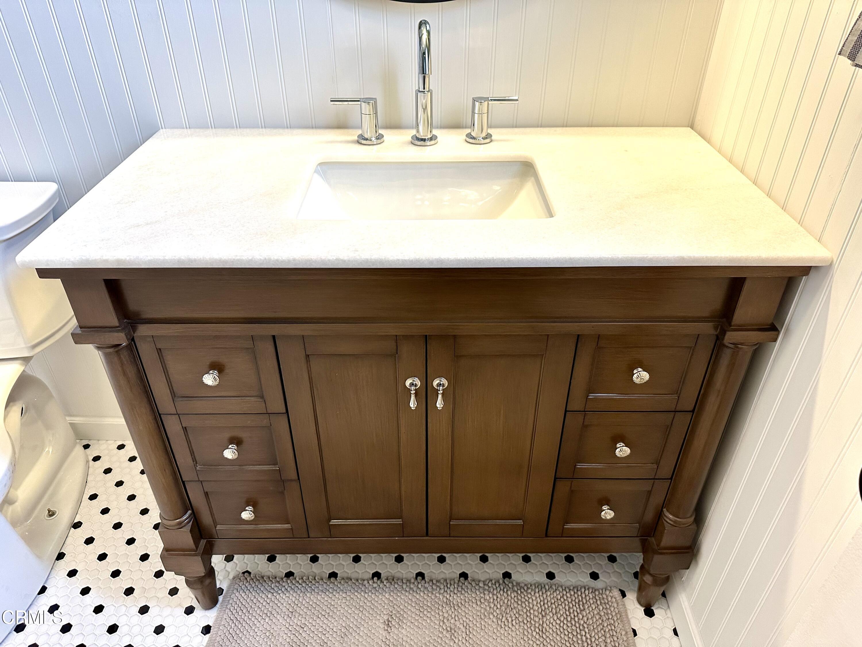 4621 Hamilton Avenue Oxnard, CA 93033 - Photo 15 of 22 a bathroom with a sink and a mirror