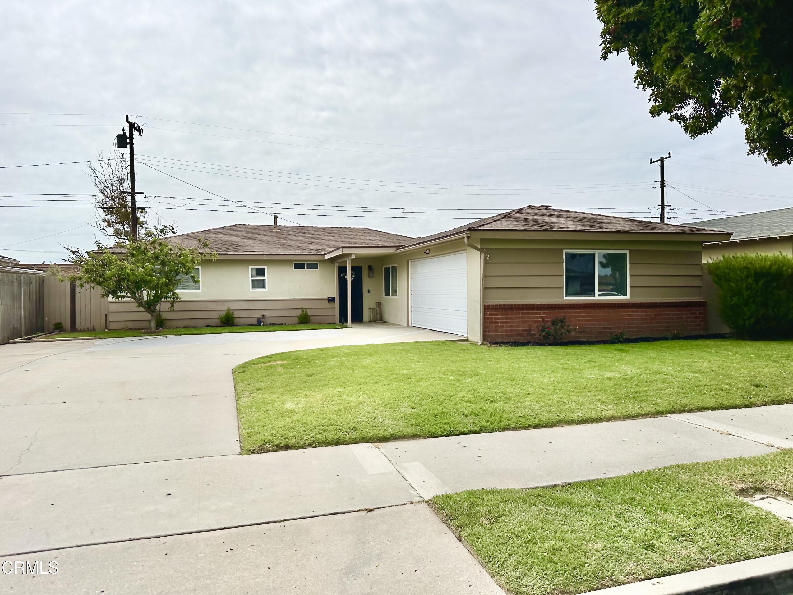 4621 Hamilton Avenue Oxnard, CA 93033 - Photo 2 of 22 a front view of a house with a garden