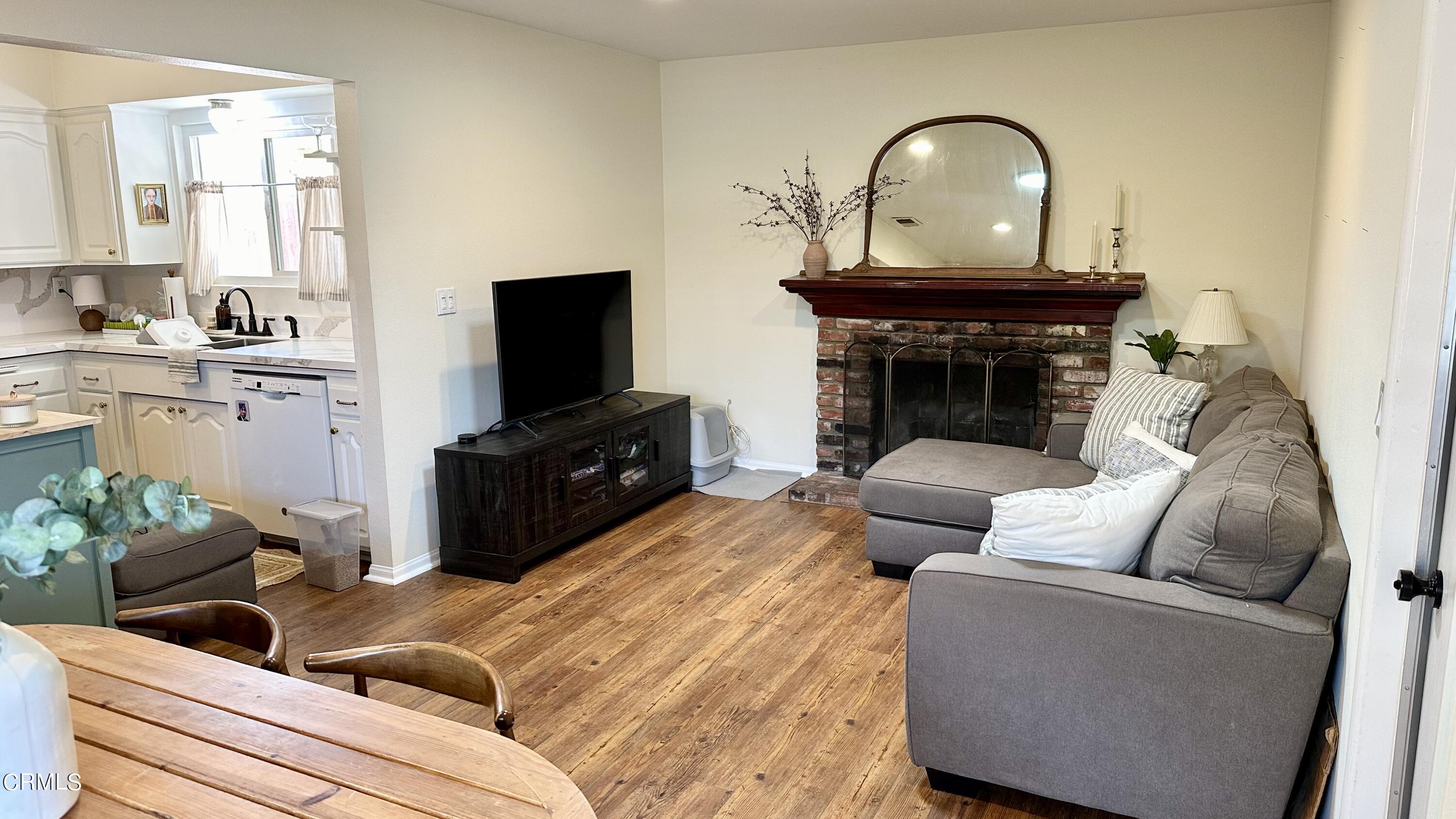 4621 Hamilton Avenue Oxnard, CA 93033 - Photo 7 of 22 a living room with furniture and a fireplace