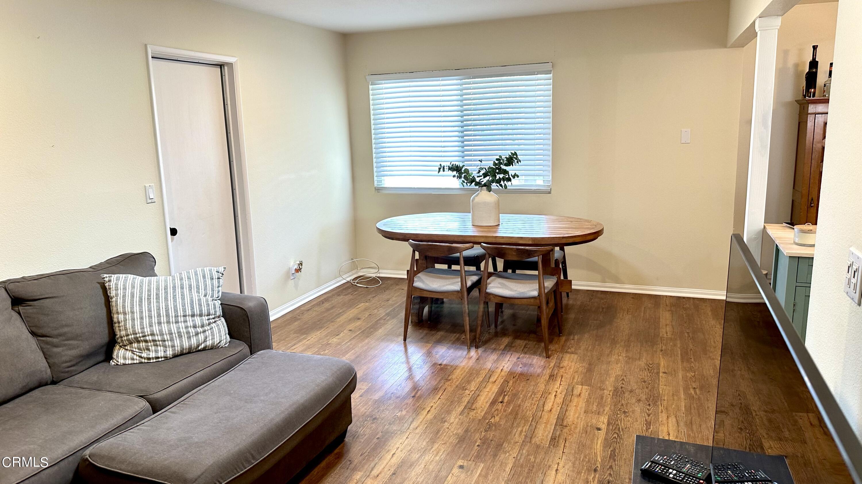 4621 Hamilton Avenue Oxnard, CA 93033 - Photo 8 of 22 a living room with furniture and a wooden floor