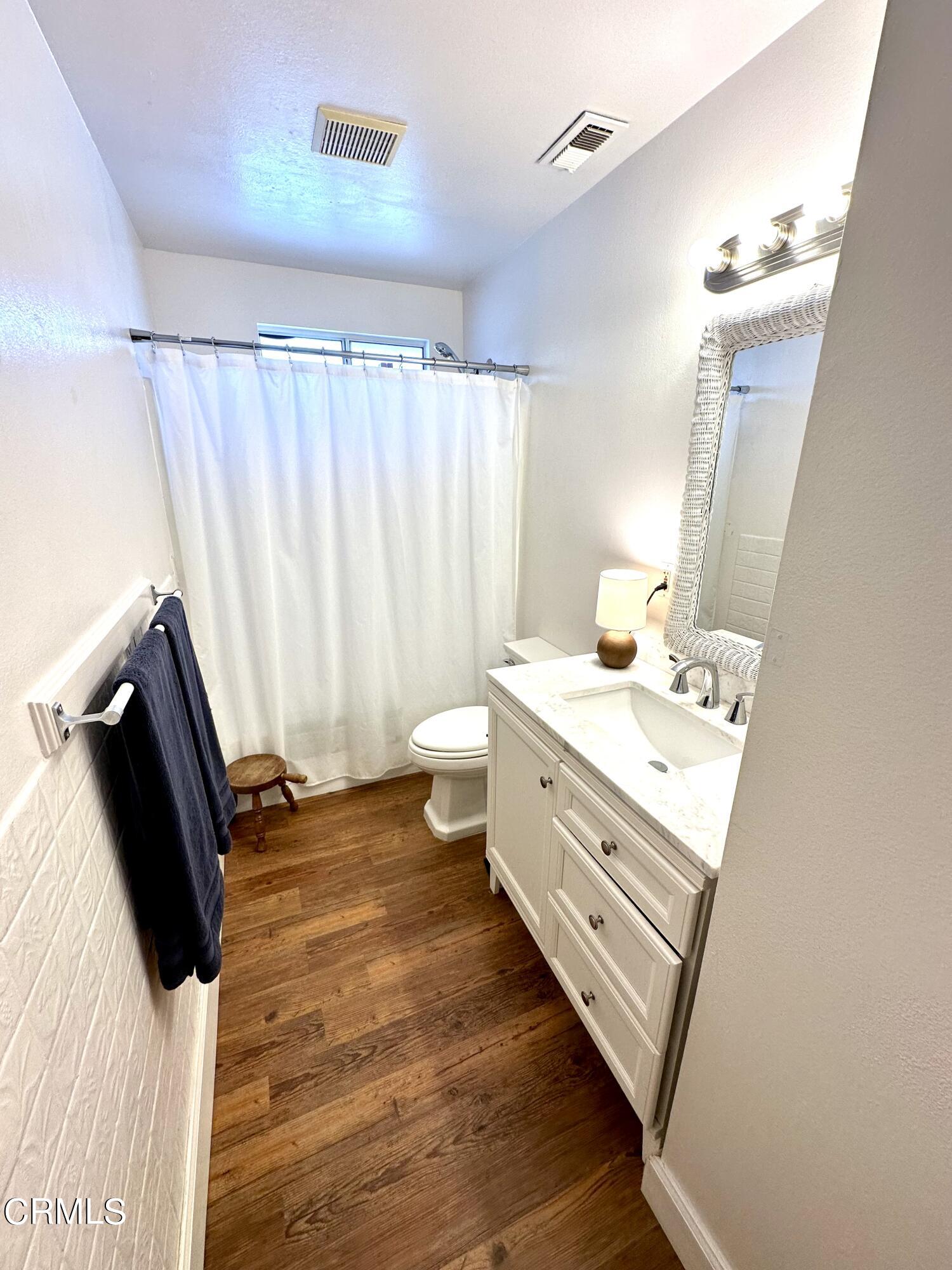 4621 Hamilton Avenue Oxnard, CA 93033 - Photo 10 of 22 a bathroom with a sink and a mirror