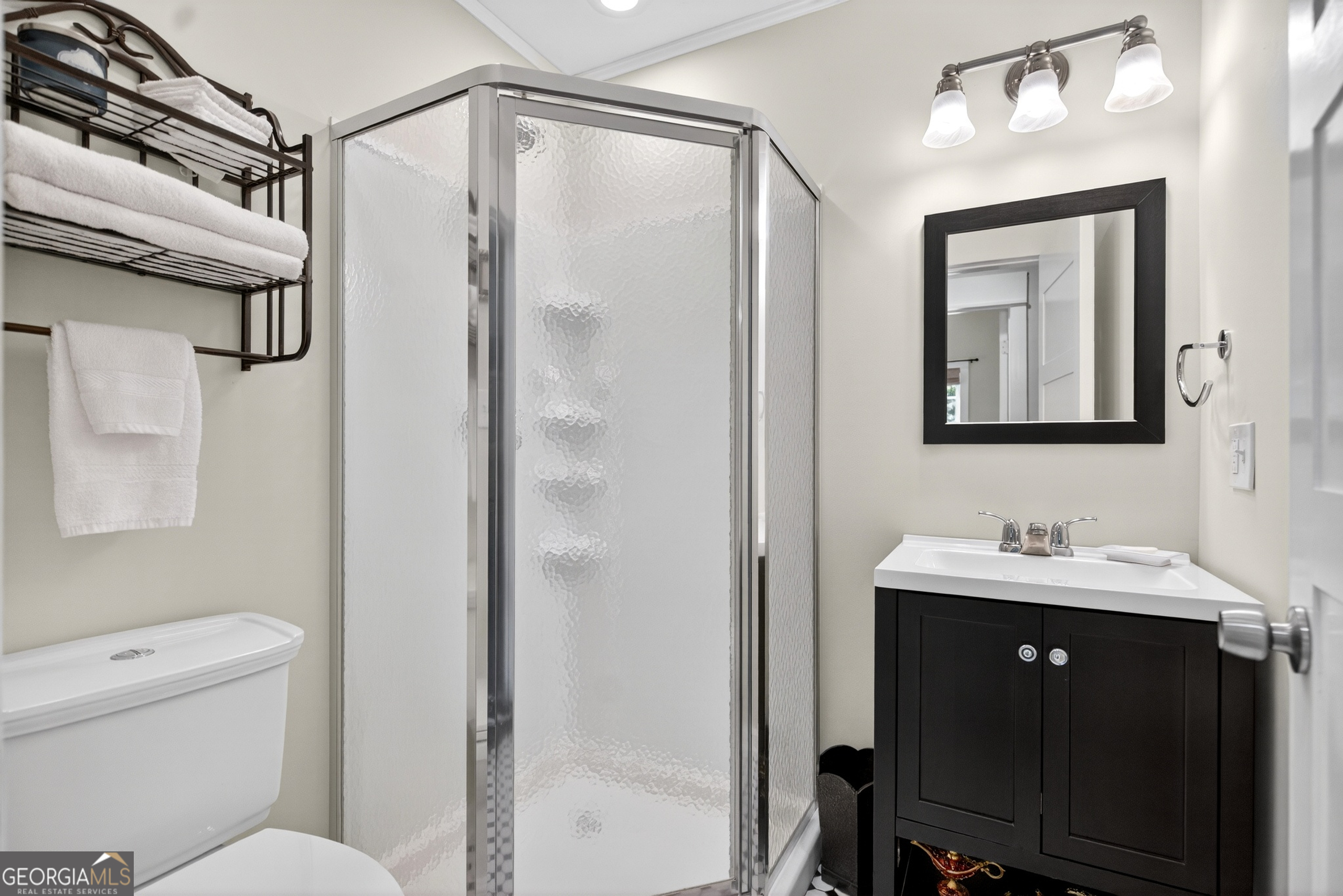 4656 Greenville Road LaGrange, GA 30241 - Photo 19 of 34 a bathroom with a shower sink vanity mirror and toilet