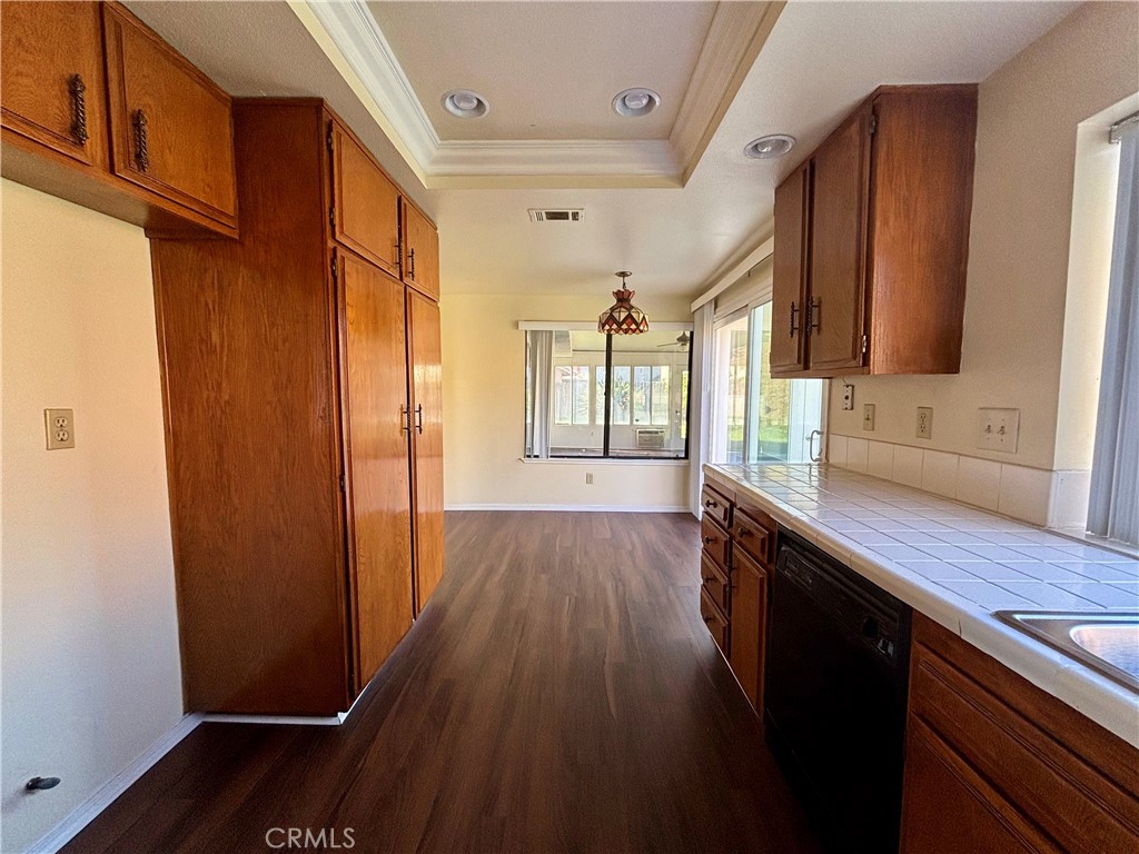 5715 Favela Drive Riverside, CA 92509 - Photo 11 of 27 a view of a hallway with wooden floor and staircase