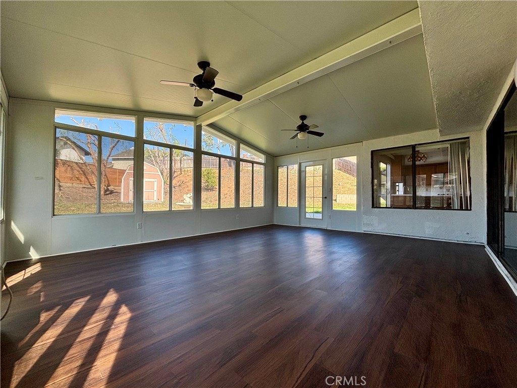 5715 Favela Drive Riverside, CA 92509 - Photo 13 of 27 a view of an empty room with wooden floor and a window