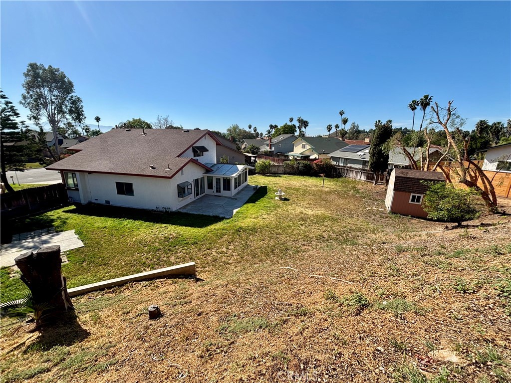 5715 Favela Drive Riverside, CA 92509 - Photo 15 of 27 a view of a house with a yard
