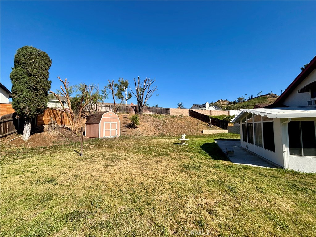 5715 Favela Drive Riverside, CA 92509 - Photo 17 of 27 a view of a house with a yard