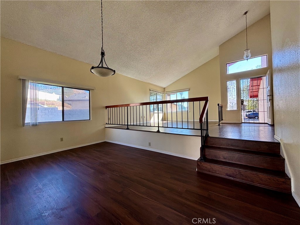 5715 Favela Drive Riverside, CA 92509 - Photo 8 of 27 a view of an empty room with wooden floor and a window