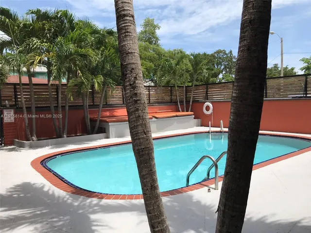 a view of a swimming pool with a patio