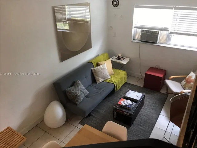 a view of staircase with wooden floor and a rug