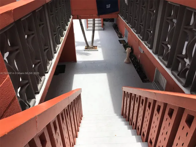 a kitchen with a refrigerator and a stove