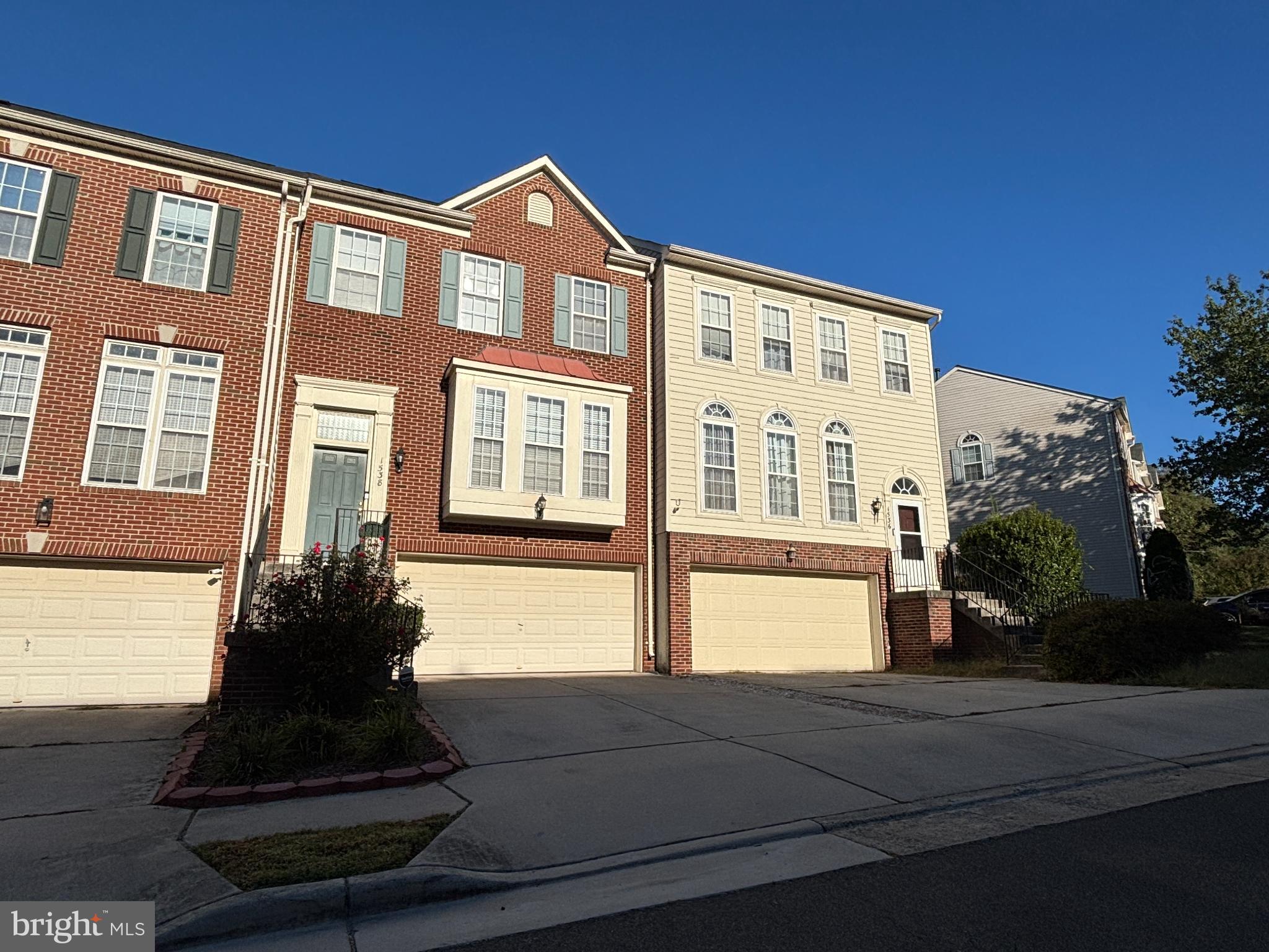 1538 Grosbeak Court Woodbridge, VA 22191 - Photo 1 of 39 a front view of a house with a garden