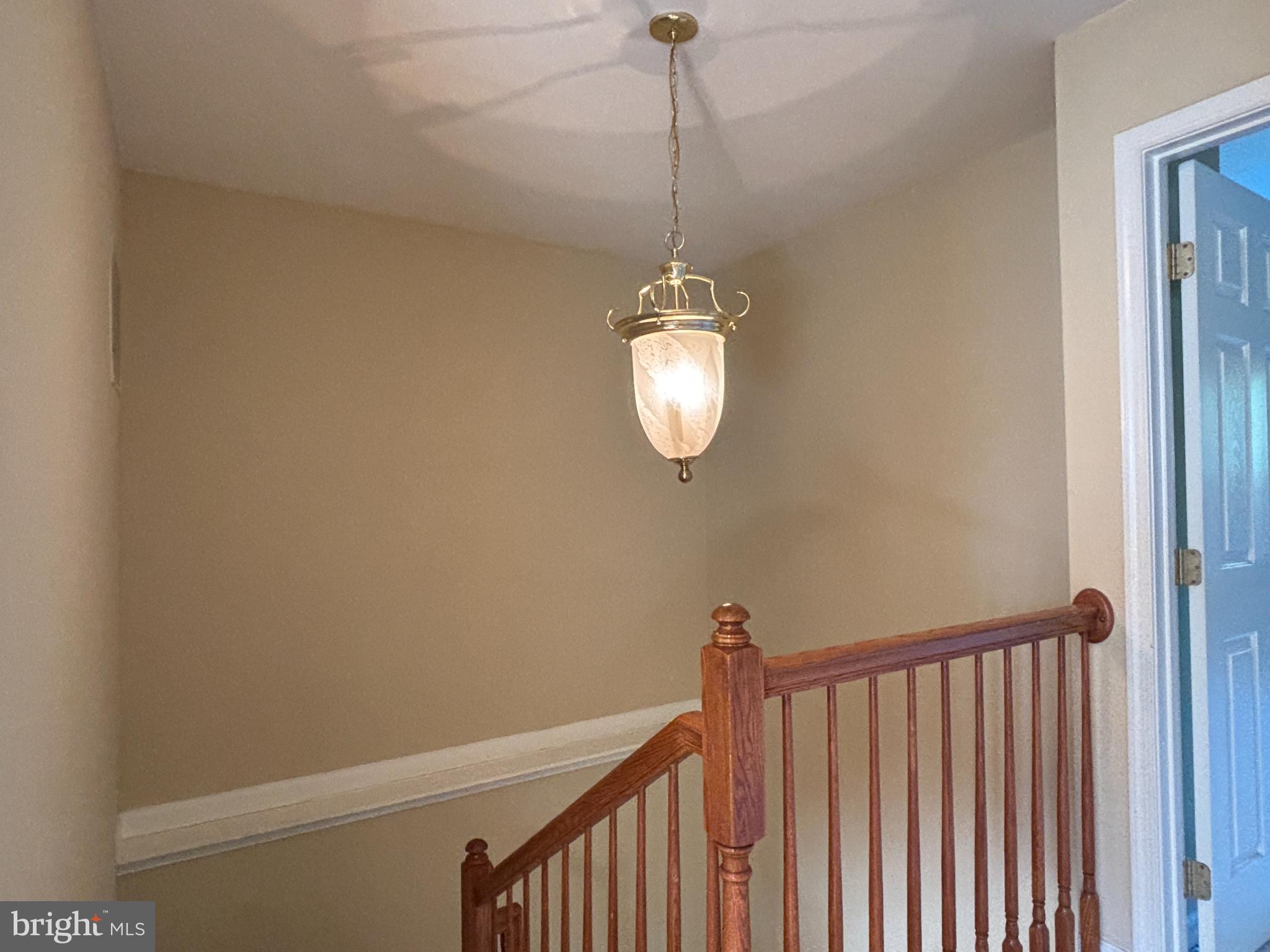 1538 Grosbeak Court Woodbridge, VA 22191 - Photo 15 of 39 a view of a hallway with a chandelier