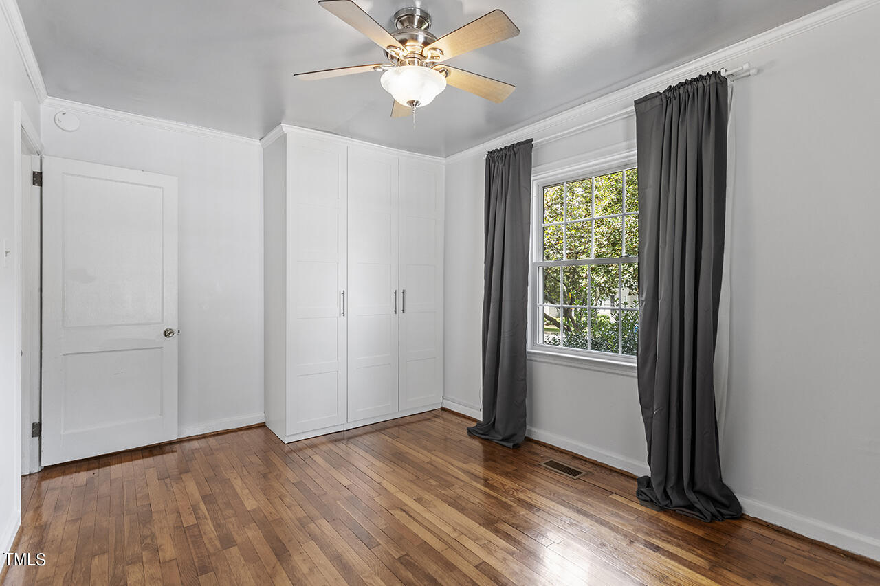 1716 Bennett Street Raleigh, NC 27604 - Photo 16 of 30 wooden floor in an empty room with a window