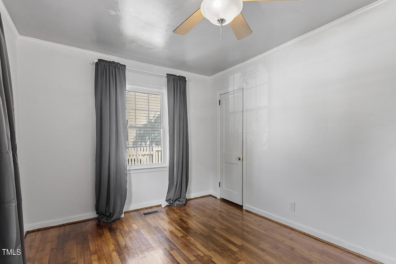 1716 Bennett Street Raleigh, NC 27604 - Photo 17 of 30 an empty room with wooden floor and windows