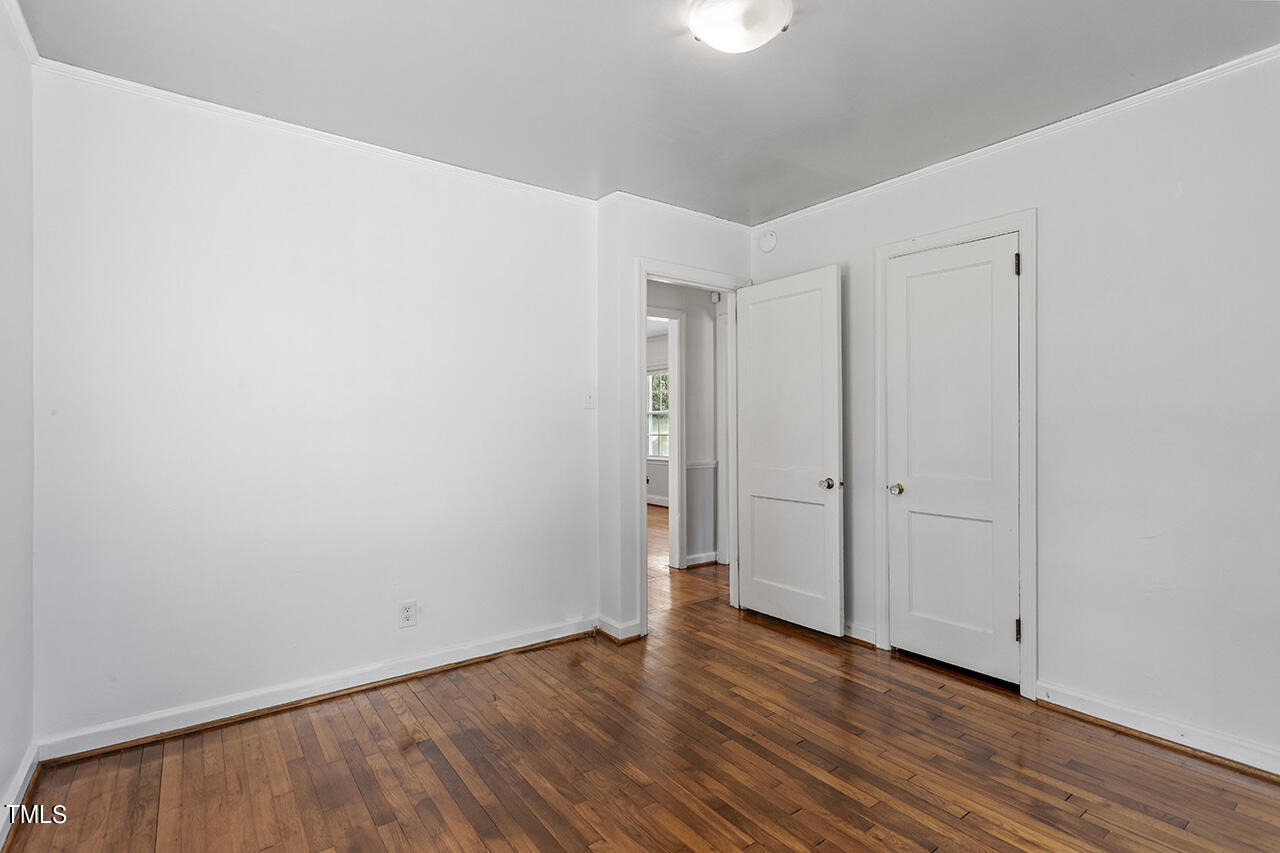 1716 Bennett Street Raleigh, NC 27604 - Photo 18 of 30 a view of an empty room with wooden floor