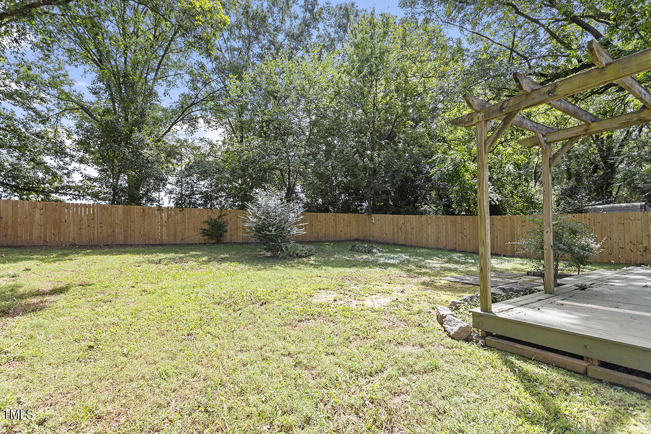 1716 Bennett Street Raleigh, NC 27604 - Photo 23 of 30 a view of a backyard with a trees
