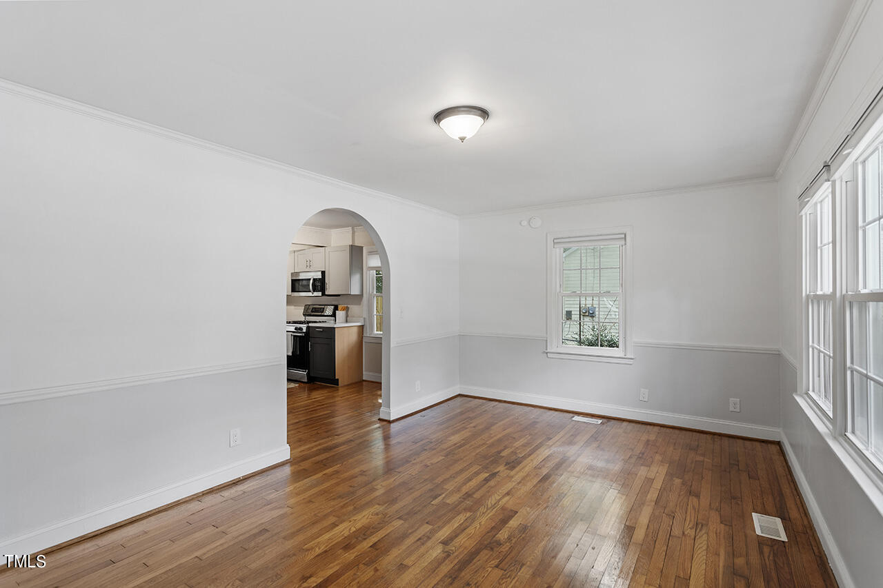 1716 Bennett Street Raleigh, NC 27604 - Photo 4 of 30 wooden floor in an empty room with a window