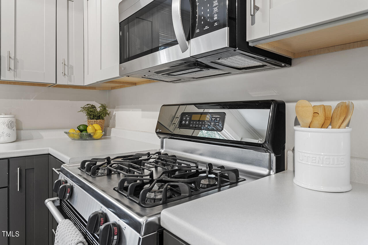1716 Bennett Street Raleigh, NC 27604 - Photo 10 of 30 a kitchen with a stove and cabinets