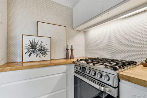 a kitchen with a stove and a microwave