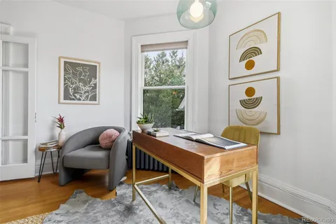 a work room with furniture and window